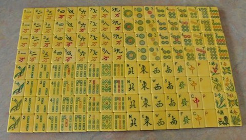 RESERVED FOR MOCLEMENS Set of 130 mahjong tiles made of French ivory  celluloid and wood, likely Parker Brothers
